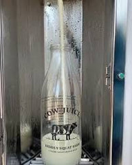 DIDDLY SQUAT COW JUICE BOTTLE CLARKSON FARM / JEREMYS FAMOUS COW JUICE BOTTLE (Empty)