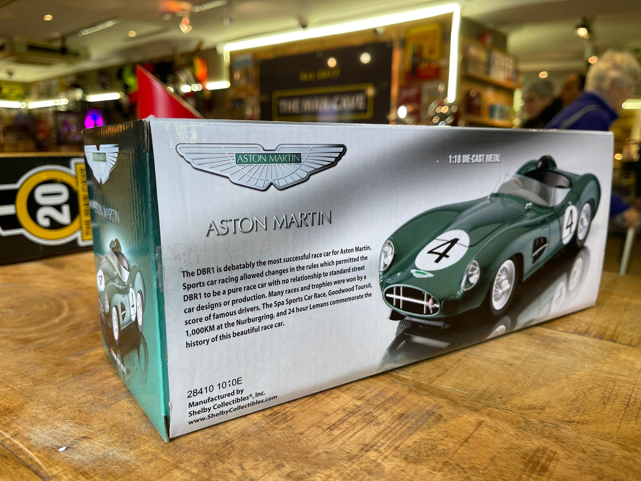 Aston Martin DBR1 1:18 model car, hand signed by British racing driver Stirling Moss