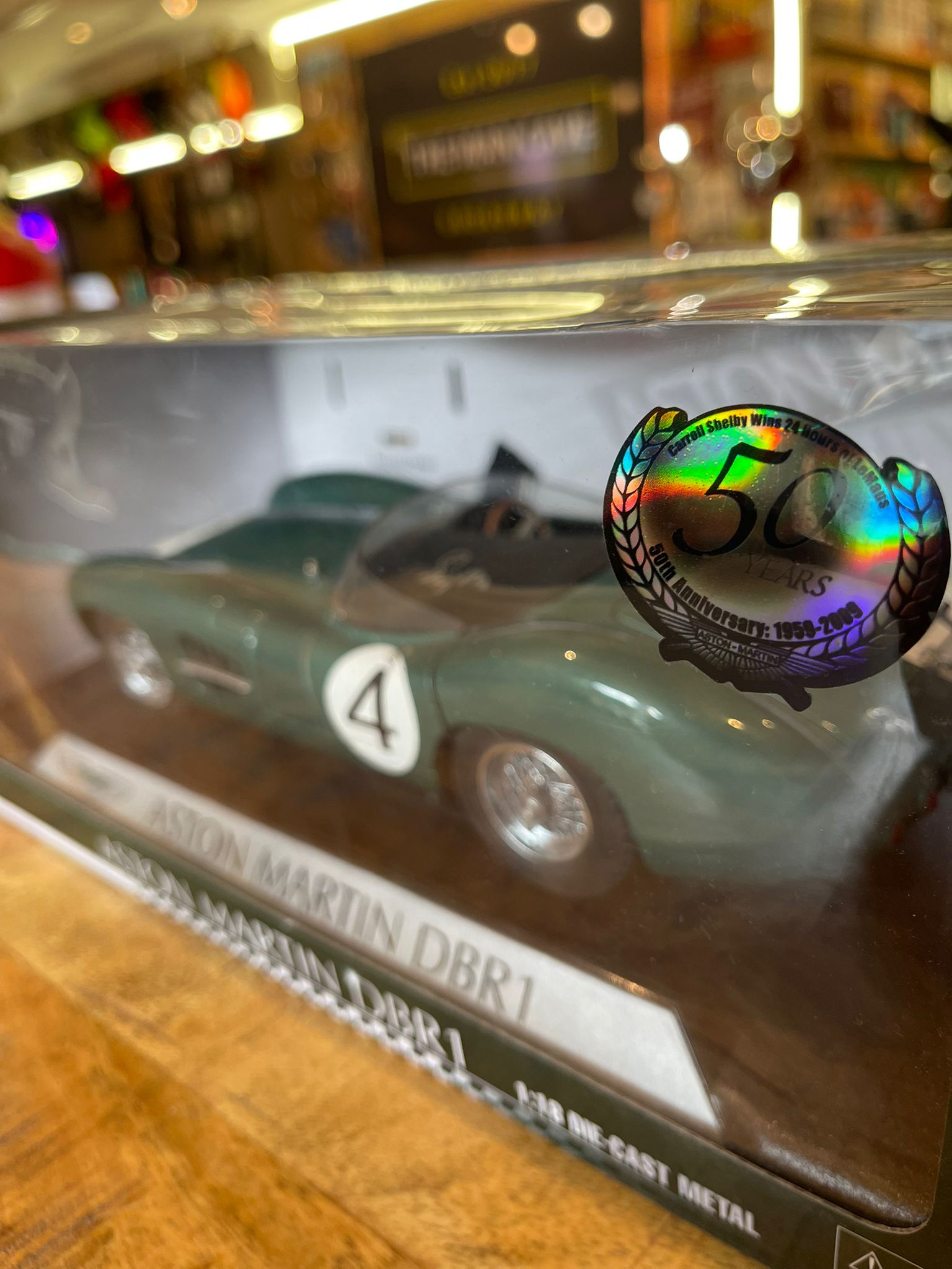 Aston Martin DBR1 1:18 model car, hand signed by British racing driver Stirling Moss