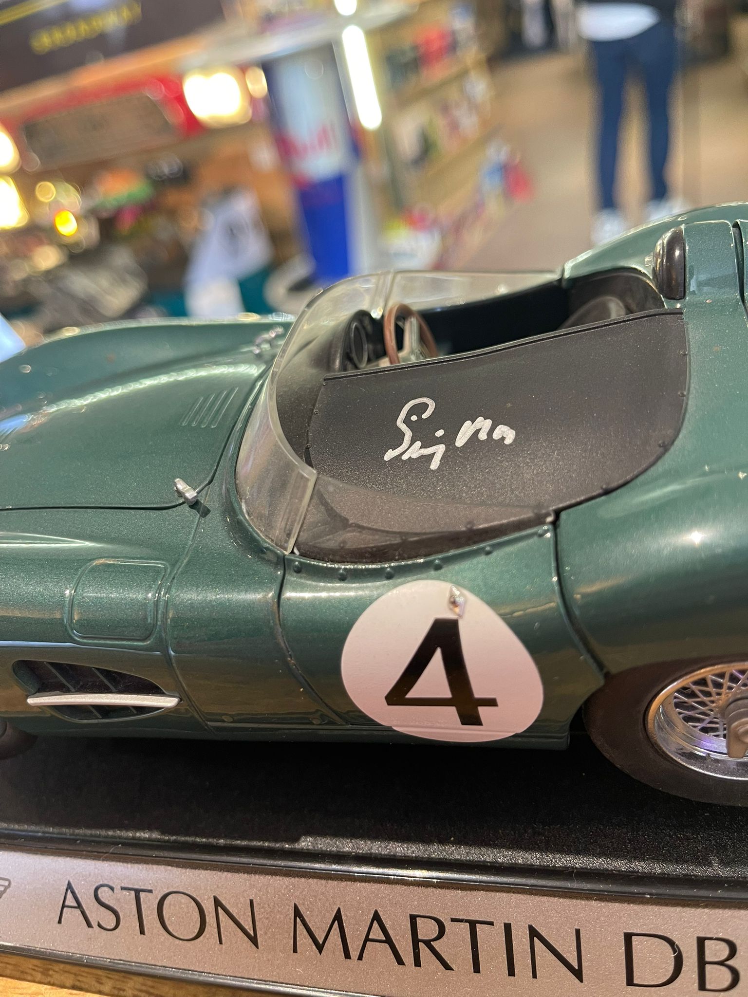 Aston Martin DBR1 1:18 model car, hand signed by British racing driver Stirling Moss - The Man Cave Broadway