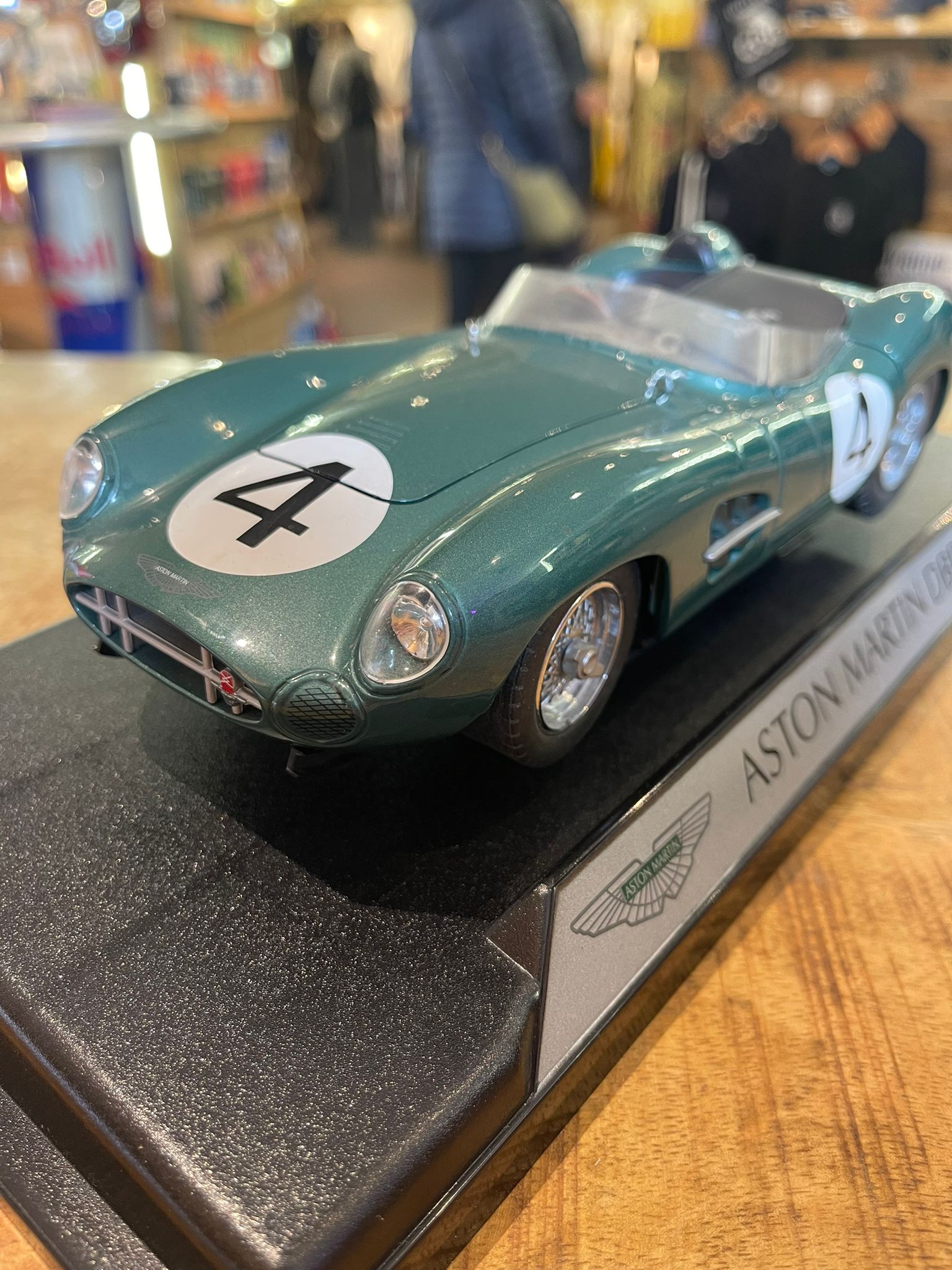Aston Martin DBR1 1:18 model car, hand signed by British racing driver Stirling Moss - The Man Cave Broadway
