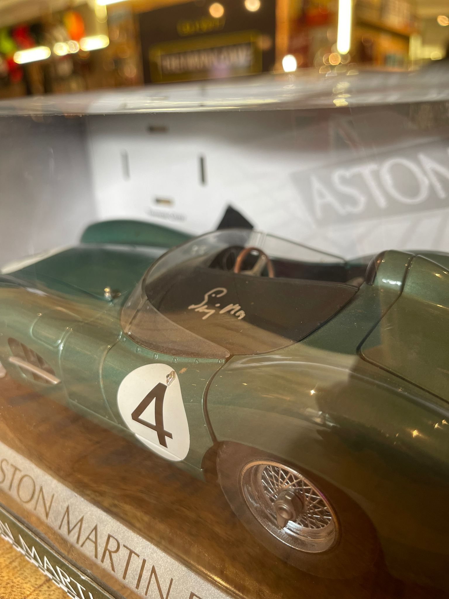 Aston Martin DBR1 1:18 model car, hand signed by British racing driver Stirling Moss - The Man Cave Broadway
