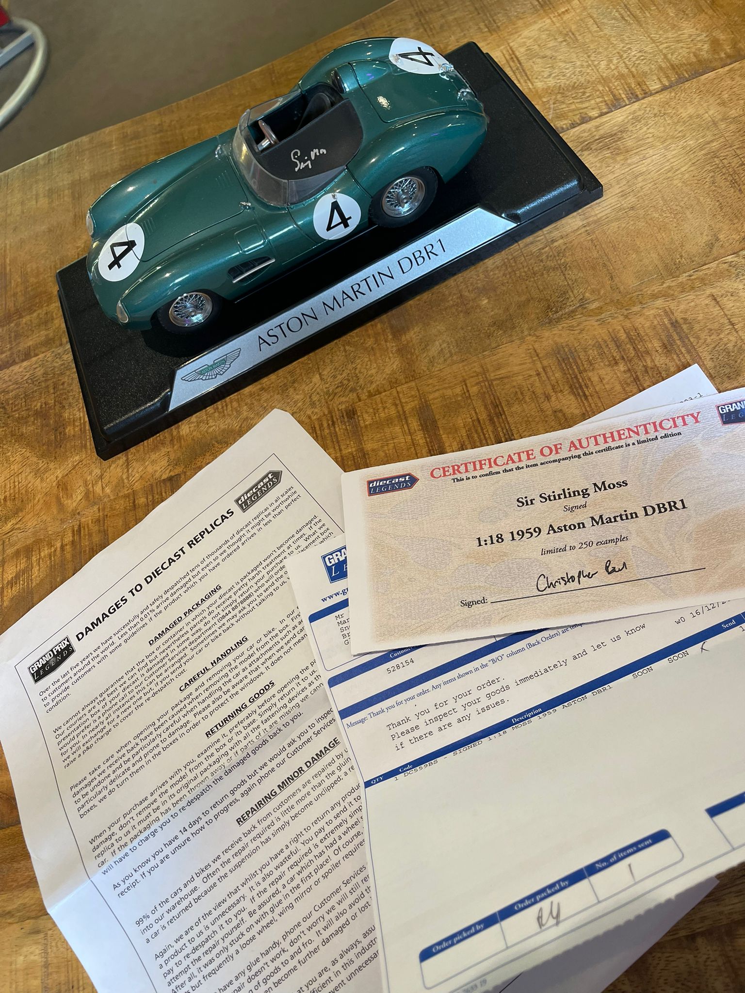 Aston Martin DBR1 1:18 model car, hand signed by British racing driver Stirling Moss - The Man Cave Broadway