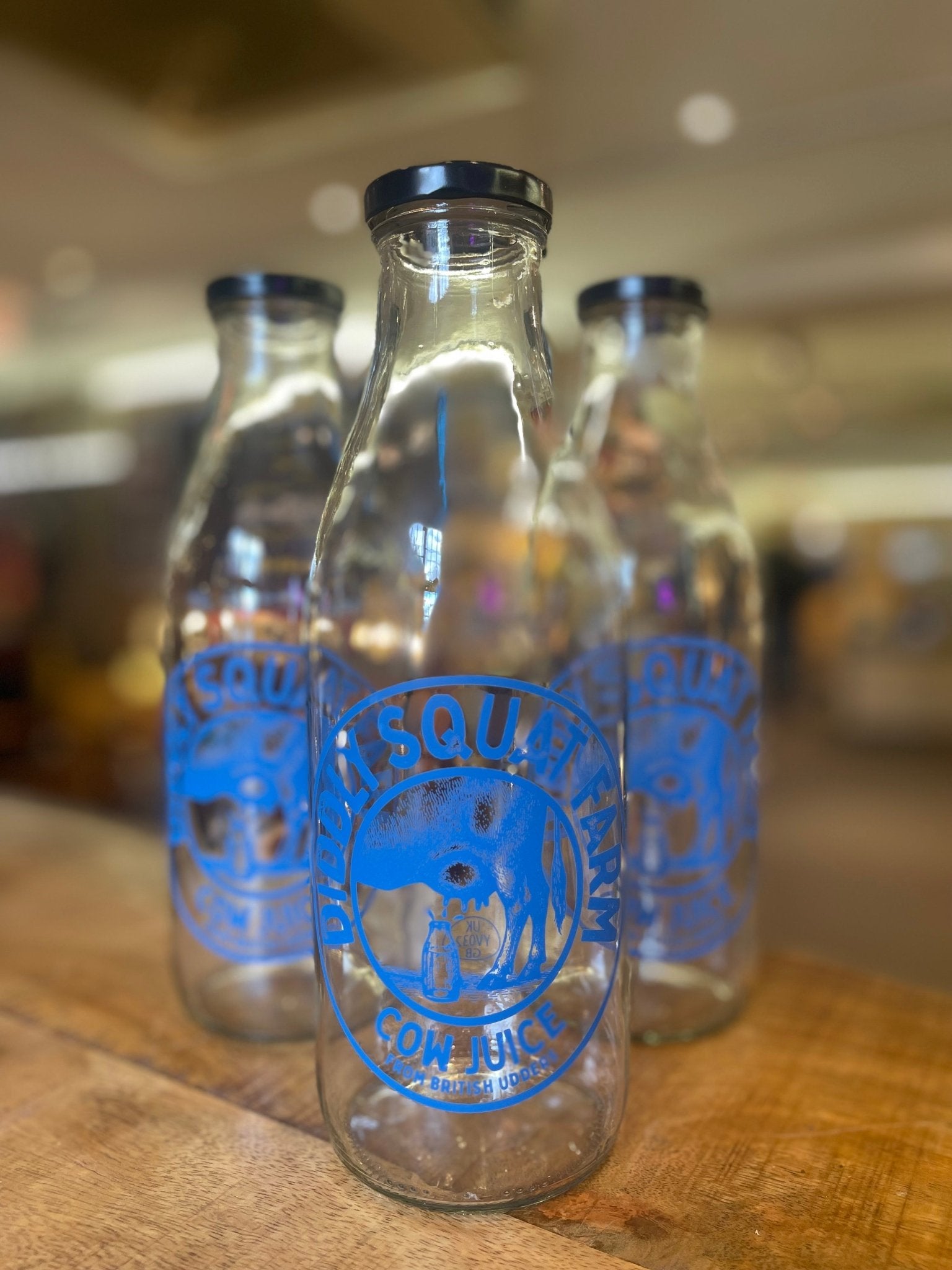 DIDDLY SQUAT COW JUICE BOTTLE CLARKSON FARM / JEREMYS FAMOUS COW JUICE BOTTLE (Empty)NEW DESIGN! - The Man Cave Broadway