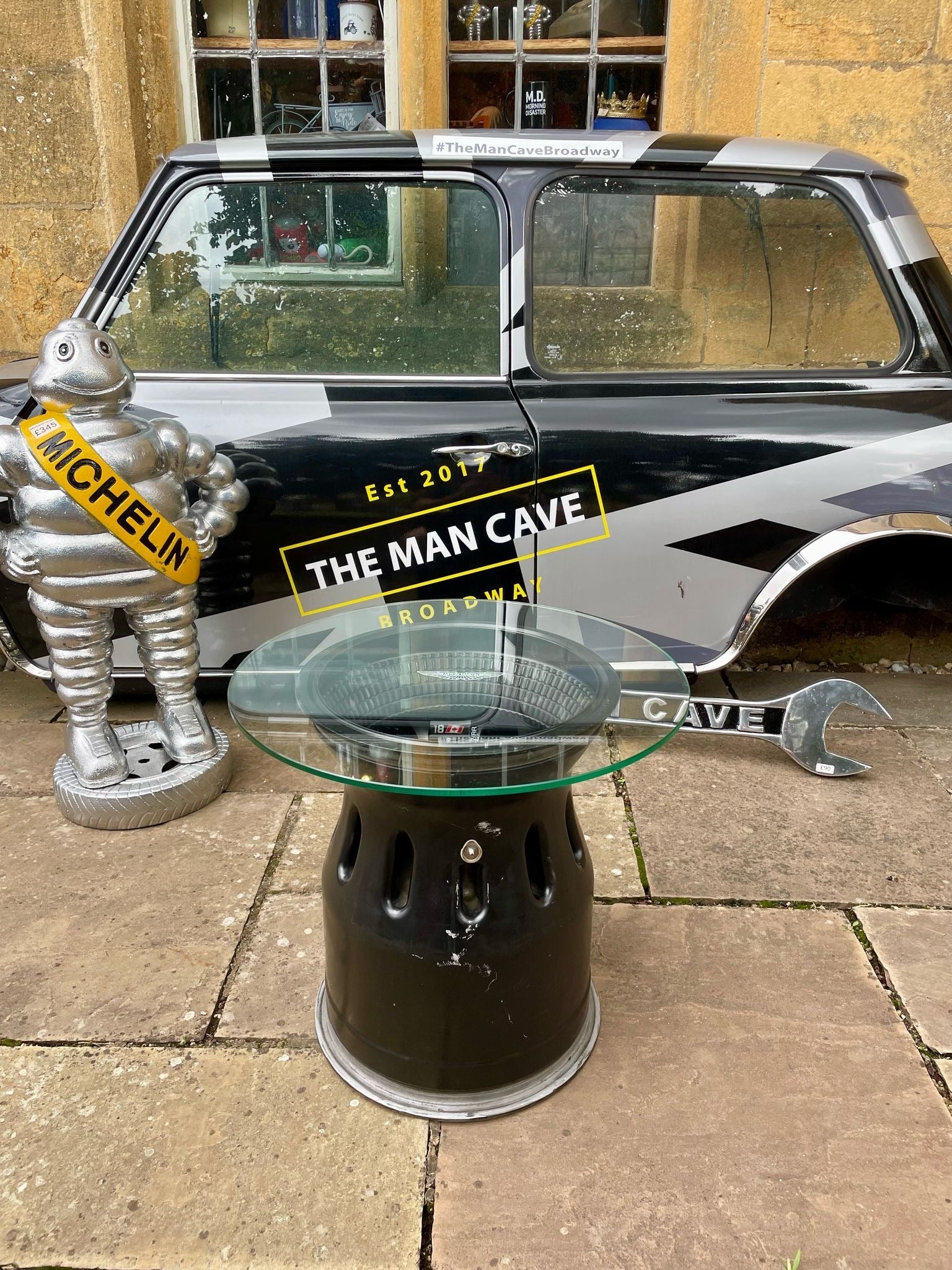Genuine Aston Martin F1 Wheel Coffee Table - The Man Cave Broadway